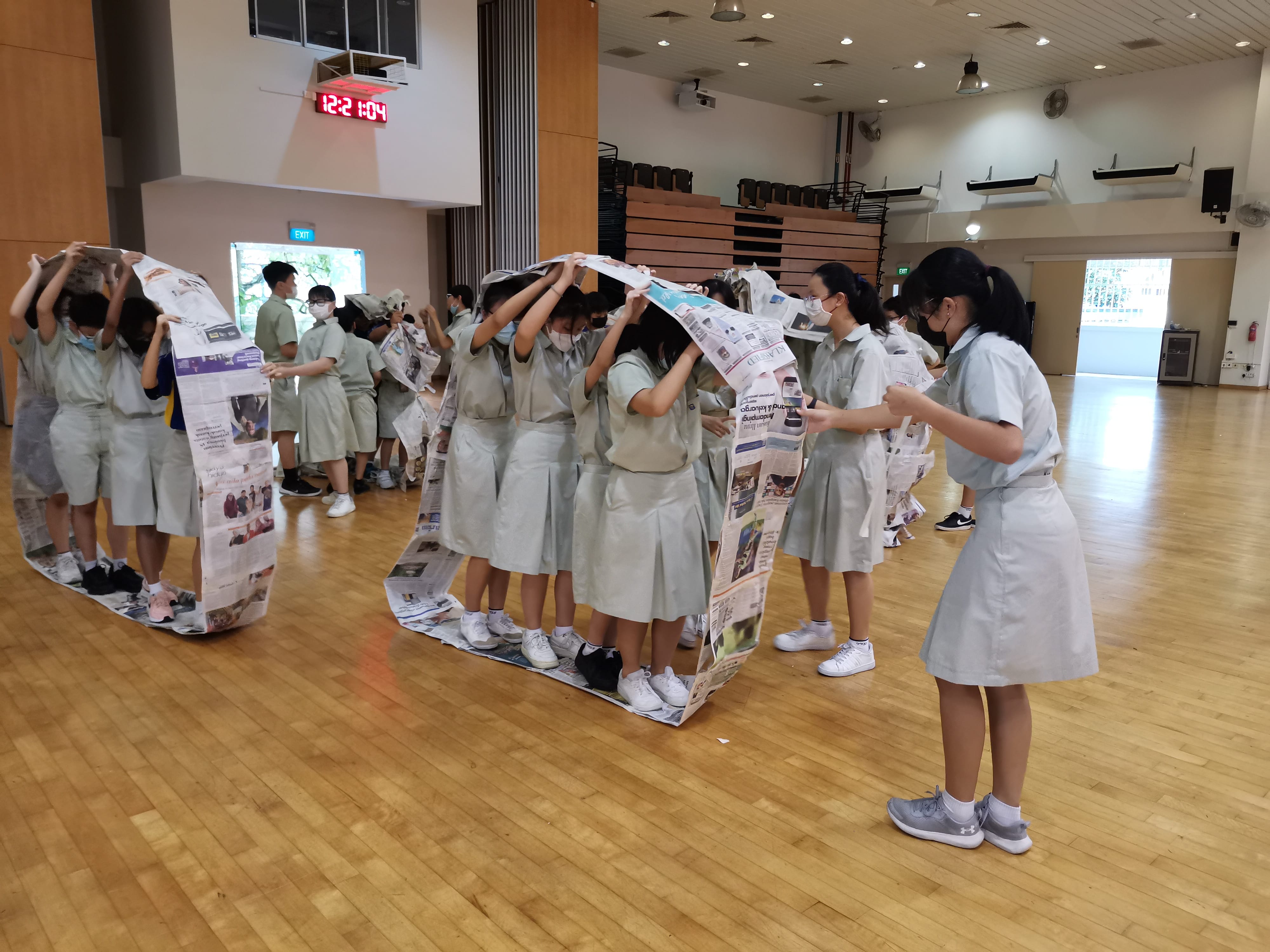 Students engaged in a teamwork activity as part of the Sec 1 Leadership training workshop